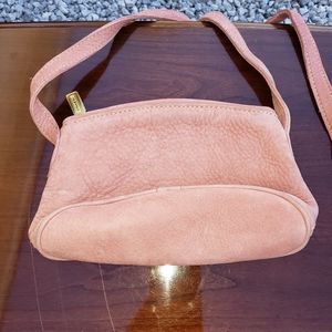 Pink Coach clutch purse with shoulder strap.